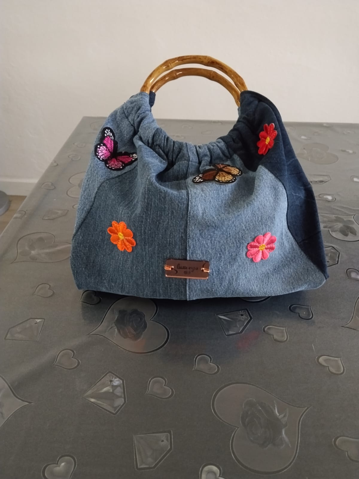 Borsa con manico di legno in denim