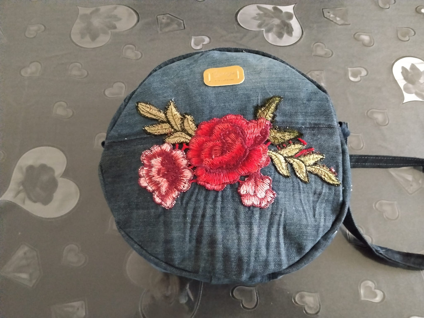 Borsa tonda in denim con fiore